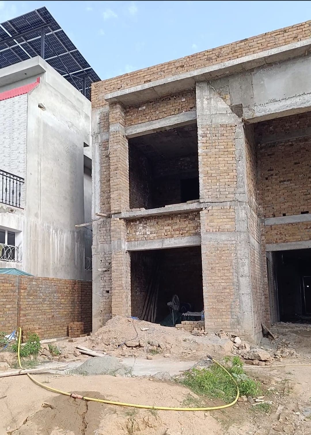 Ground and first floor openings cast and built up in brick
